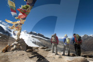 A windy prayer flag strewn cairn marks the top of the Kagmara La which is the highest point in the Kagmara valley at 5115m in Do