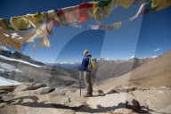 A windy prayer flag strewn cairn marks the top of the Kagmara La which is the highest point in the Kagmara valley at 5115m in Do