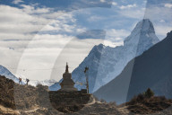 Trekkers near a chorten in the Everest region with the peak of Ama Dablam in the distance, Himalayas, Nepal, Asia