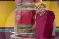 A monk spins a prayer wheel at Diskit Monastery in the Nubra valley in India