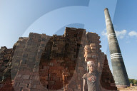 A young man carries a pile of bricks on his head at a brick factory in Bangladesh