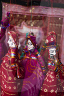 Colorful puppets hanging in a shop in Udaipur, Rajasthan, India, Asia