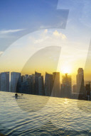 Infinity pool on the roof of the Marina Bay Sands Hotel with spectacular views over the Singapore skyline at sunset, Singapore, Southeast Asia, Asia