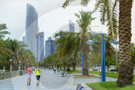 Joggers on the Corniche, Abu Dhabi, United Arab Emirates, Middle East