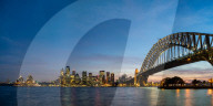 Sydney's iconic buildings are lit up as dusk settles over the city.