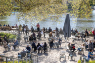 Members of the public enjoy the sunshine in London.