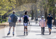 Members of the public enjoy the sunshine in Hyde Park.