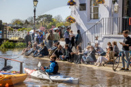 Members of the public enjoy the sunshine in London.