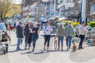 Members of the public enjoy the sunshine in London.