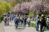 Members of the public enjoy the sunshine in London.