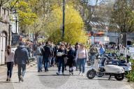 Members of the public enjoy the sunshine in London.
