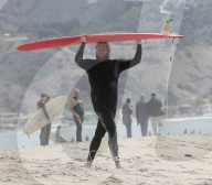 Jonah Hill, 37, is all smiles as he enjoys a solo surf session on Malibu Beach.