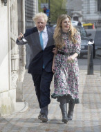Boris Johnson and Carrie Symonds arrive to vote today in Westminster.