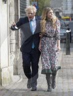 Boris Johnson and Carrie Symonds arrive to vote today in Westminster.