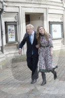 Boris Johnson and Carrie Symonds arrive to vote today in Westminster.