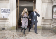 Boris Johnson and Carrie Symonds arrive to vote today in Westminster.