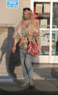 Jessica Simpson enjoys a serious junk food fix while rocking flashy green Frankenstein boots and a colorful outfit during a rare public outing near her home in Calabasas.