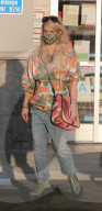 Jessica Simpson enjoys a serious junk food fix while rocking flashy green Frankenstein boots and a colorful outfit during a rare public outing near her home in Calabasas.