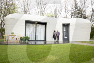 Dutch couple become Europe’s first inhabitants of a 3D-printed house. New home in shape of boulder is first legally habitable property with load-bearing walls made using 3D-printing technology