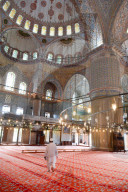 Blue Mosque interior, UNESCO World Heritage Site, mullah in foreground, Istanbul, Turkey, Europe