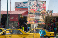 Street scene with religious poster, Qom, Iran