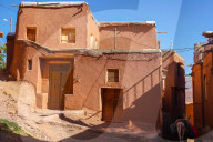 Winding lanes and donkey in 1500 year old traditional village of red mud brick houses, Abyaneh, Iran