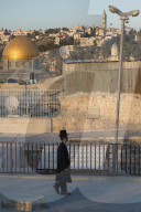 Orthodox Jews on the roof leading to Galicia Courtyard. Jerusalem Old City. Israel.