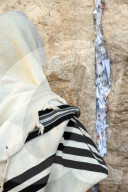 Jew with prayer shawl praying at the Western Wall. Jerusalem ld City. Israel.