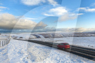 Motorists negotiate the B4520 road between Brecon and Builth Wells on the Mynydd Epynt moorland, Powys, Wales, UK.