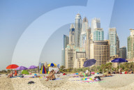 Sunbathers on the Public Dubai Beach at JBR (Jumeirah Beach Resort), Dubai, United Arab Emirates, Middle East