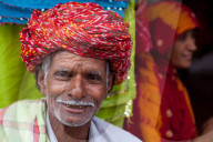 Old man in traditional turban outside a shop in Deogarh