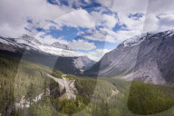 The Icefields Parkway running through dramatic Canadian Rockies scenery, Banff National Park, Alberta, Canada. Autumn 2015.