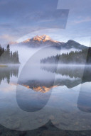 Pyramid Mountain in the Canadian Rockies reflected in Pyramid Lake, Jasper National Park, Alberta, Canada. Autumn 2015.