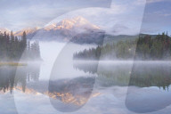 Mist shrouded Pyramid Lake at dawn in the Canadian Rockies, Jasper National Park, Canada. Autumn (September) 2015.