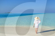 Woman on sandbank, Rasdhoo Island, Northern Ari Atoll, Maldives (MR)