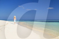 Woman on beach, Rasdhoo Island, Northern Ari Atoll, Maldives (MR)