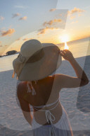 Woman on beach at Olhuveli Beach and Spa Resort, South Male Atoll, Kaafu Atoll, Maldives (PR + MR)