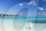 Woman on beach at Olhuveli Beach and Spa Resort, South Male Atoll, Kaafu Atoll, Maldives (PR + MR)