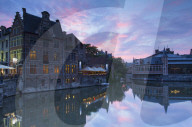 Canalside cafes on Leie Canal at sunset, Ghent, Flanders, Belgium