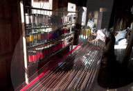 Woman arranging silk threads by colour at Ko Than Hlaing Weaving workshop, Inpawkhon, on Inle Lake, Shan state.