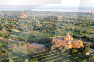 Early morning sunshine over the terracotta temples of Bagan, the Irrawaddy river in the distance, Bagan, Mandalay Division.