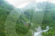 A view of waterfalls and forest from the Flam Railway, Flamsbana. Flam, Norway