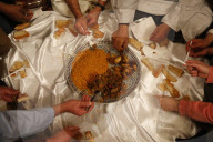 Muslims sharing a meal.