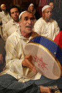 Alawi sufi muslims singing and playing drums.