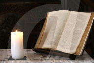 Carouge protestant temple.  Old bible and church candle.