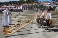 Saint-Gervais traditional mountain guides festival.  Alphorn players.