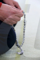 Man praying in a mosque.  Tasbih (prayer beads).