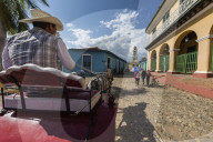 A horse-drawn cart known locally as a coche in Plaza Mayor, in the UNESCO World Heritage town of Trinidad, Cuba.