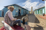 A horse-drawn cart known locally as a coche in Plaza Mayor, in the UNESCO World Heritage town of Trinidad, Cuba.