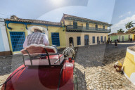A horse-drawn cart known locally as a coche in Plaza Mayor, in the UNESCO World Heritage town of Trinidad, Cuba.